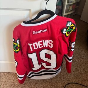 Men’s Reebok Red and White Toews Hockey Jersey